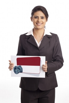 Girl dressed in formals holding card board