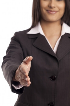 smiling businessman offering a handshake
