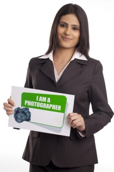 corporate woman posing with a message board