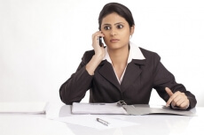 young official girl using a cell phone at work
