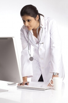 lady doctor working on the computer