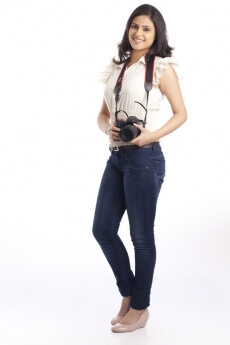 college girl posing with a digital camera