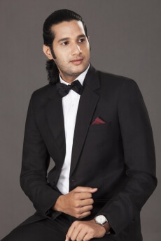 business executive posing while sitting on chair