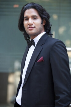 guy dressed in formals posing for the camera