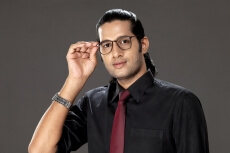 young man posing in office attire 