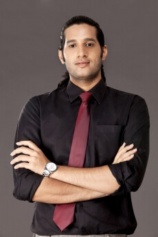 man posing in office attire 