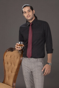 man standing with drink in his hand