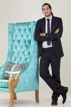 a young dynamic business person looking at the camera and posing 