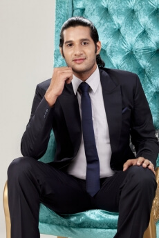 young business man posing while sitting on chair 
