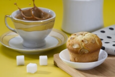 a sugar cube splashed in tea
