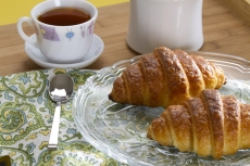fresh sweet bun with tea and butter