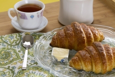 fresh sweet bun with tea and butter