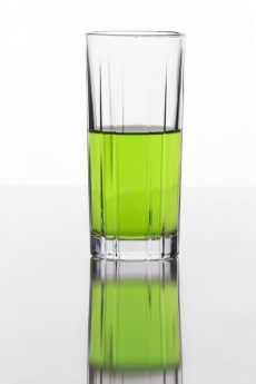 half filled glass of a soft drink