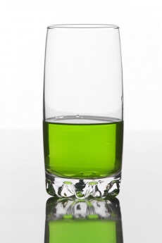 half filled glass of a soft drink