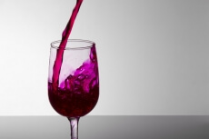 grape wine pouring into a wine glass