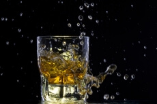 whiskey splashing from a glass