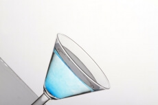 blue martini in a cocktail glass