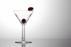 fresh grapes in a cocktail glass isolated on a white background