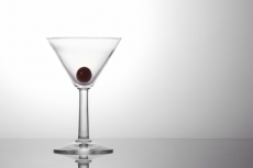 a piece of fresh grape in a cocktail glass