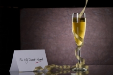champagne glass with frills and note