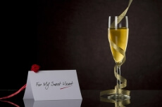 champagne glass with frills and note