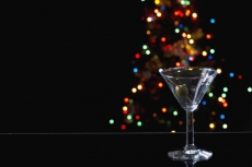 an empty martini glass with olive in it