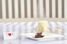 love message with chocolates and candles