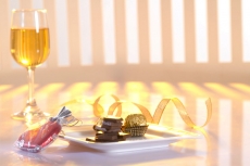 close-up on champagne with chocolate bars on a plate