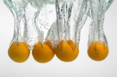oranges immersed in water creating an art