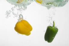 fresh capsicums dropped in water