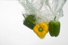 fresh capsicums dropped in water