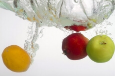 raw fruits sinked in a water tank