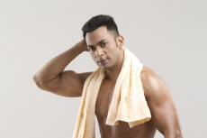 man posing with a towel