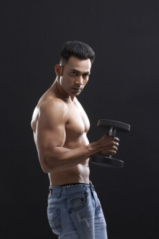 guy holding heavy dumbbells
