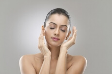 beautiful young woman protecting and caring her skin