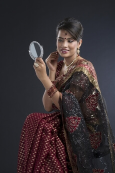 woman adoring herself while looking in the mirror