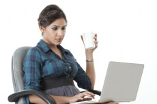 corporate girl with a laptop and coffee