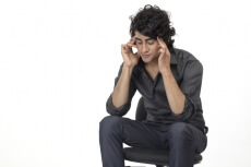 a man sitting on chair in depression 