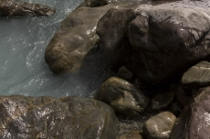 water flowing through stones