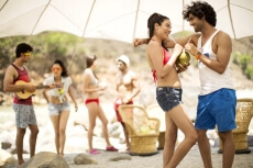 couples having a talk while sipping coconut water