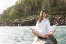 young woman against a beatiful forest background