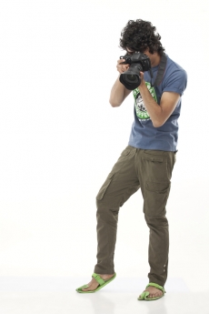 boy with curly hair aiming for a sensitive shot