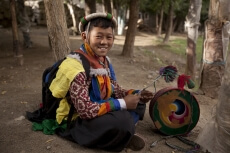 boy with ladakhi ceremonial drums
