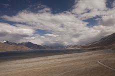 desert scenic view of high mountain and a car