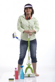 woman posing in casual clothing with cleaning products