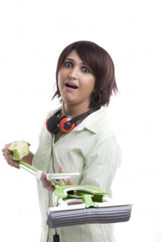 modern woman listening to music and cleaning