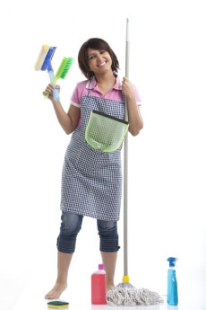 woman standing with cleaning products