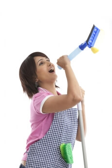 housewife singing while cleaning