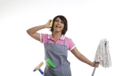 young housewife having fun while cleaning