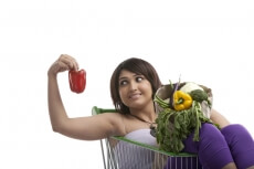 housewife picking up capsicum